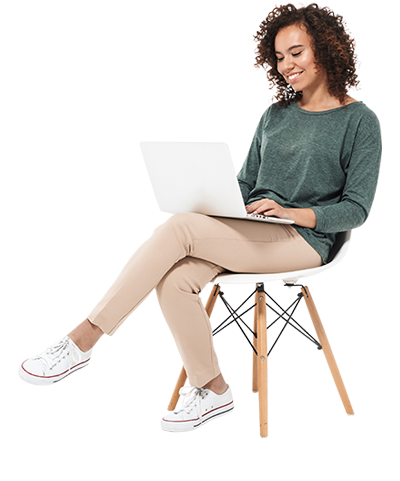 Young woman in chair with laptop